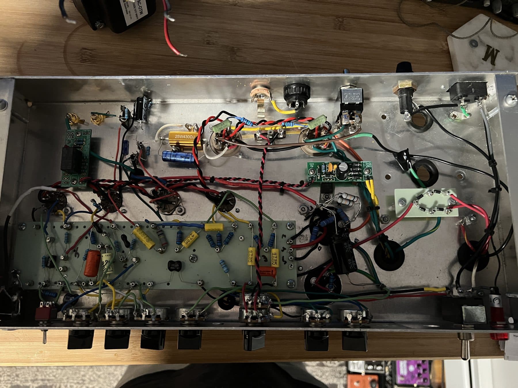 Underside of a tube amp chassis with eyelet board and point-to-point wiring